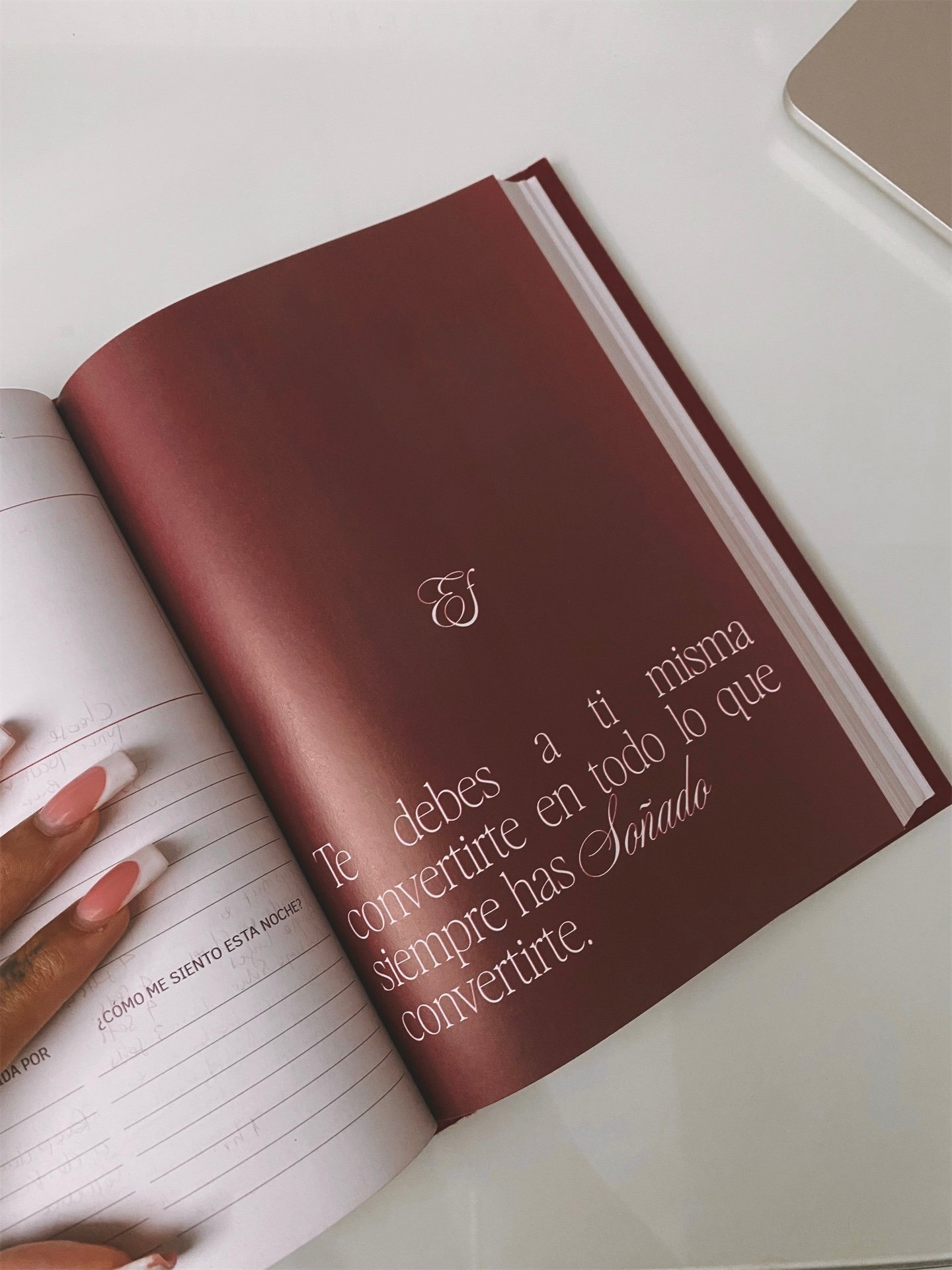 Ellafits Journal open. A journal for self love, vision and action made with the brand ellafits a premium journaling and lifestyle, the journal is red and editorial and classic